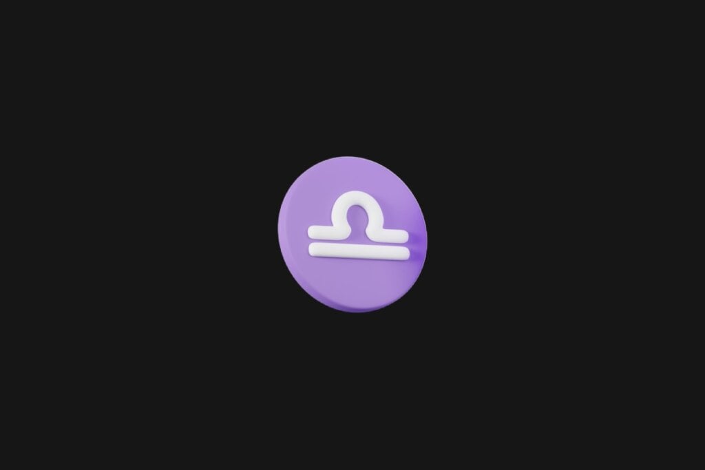Ilustração do signo de libra em um círculo roxo e em cima de um fundo preto