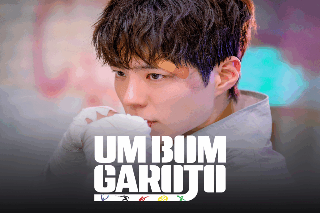 Imagem de um homem com cabelo curto e franja com um curativo no olho e com as mãos com faixas de luta e embaixo está escrito o nome do dorama