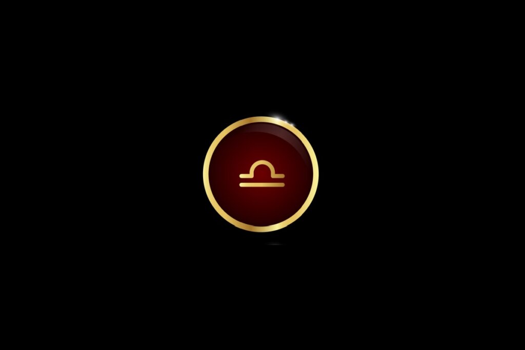 Ilustração do signo de libra dentro de um círculo dourado, iluminado com uma luz vermelha, em um fundo preto