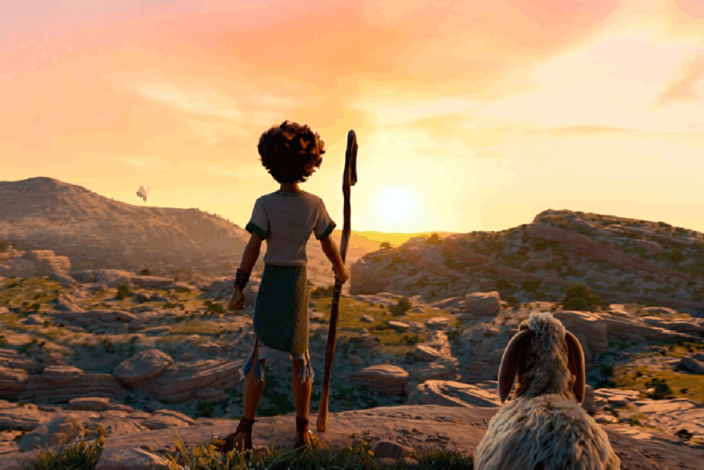 Menino com cajado observando o horizonte ao pôr do sol, acompanhado por uma ovelha em uma paisagem natural