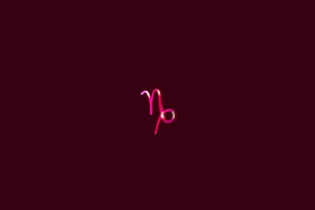 Ilustração do signo de Capricórnio em um fundo vermelho