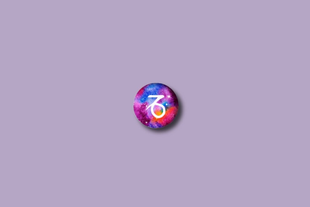 Ilustração do signo de capricórnio em um círculo colorido e sobre um fundo lilás