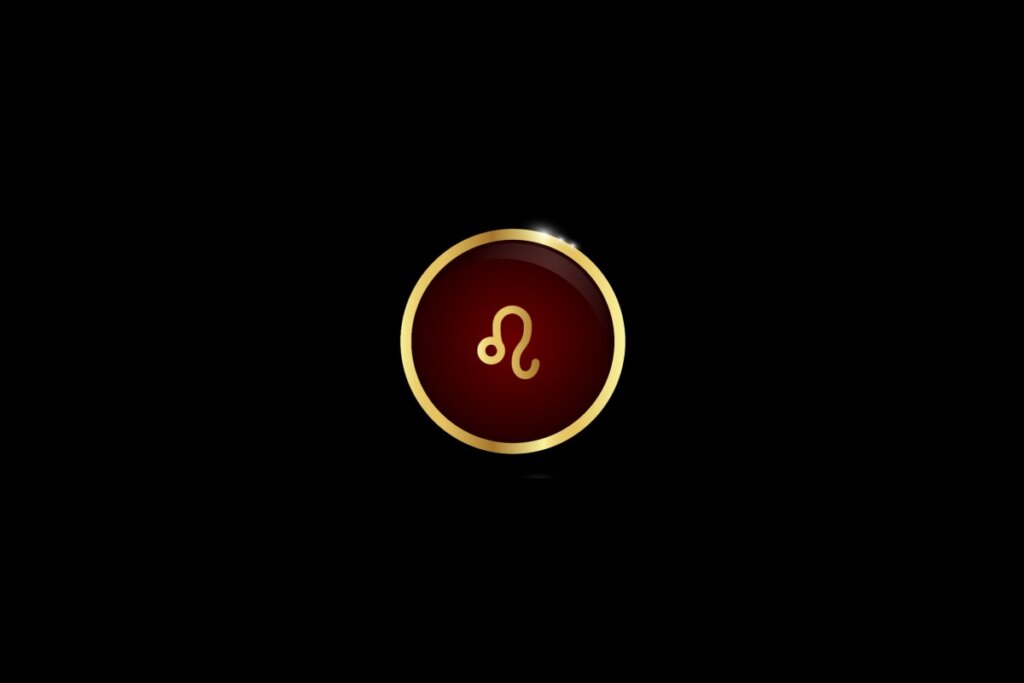 Ilustração do signo de leão dentro de um círculo dourado, iluminado com uma luz vermelha, em um fundo preto