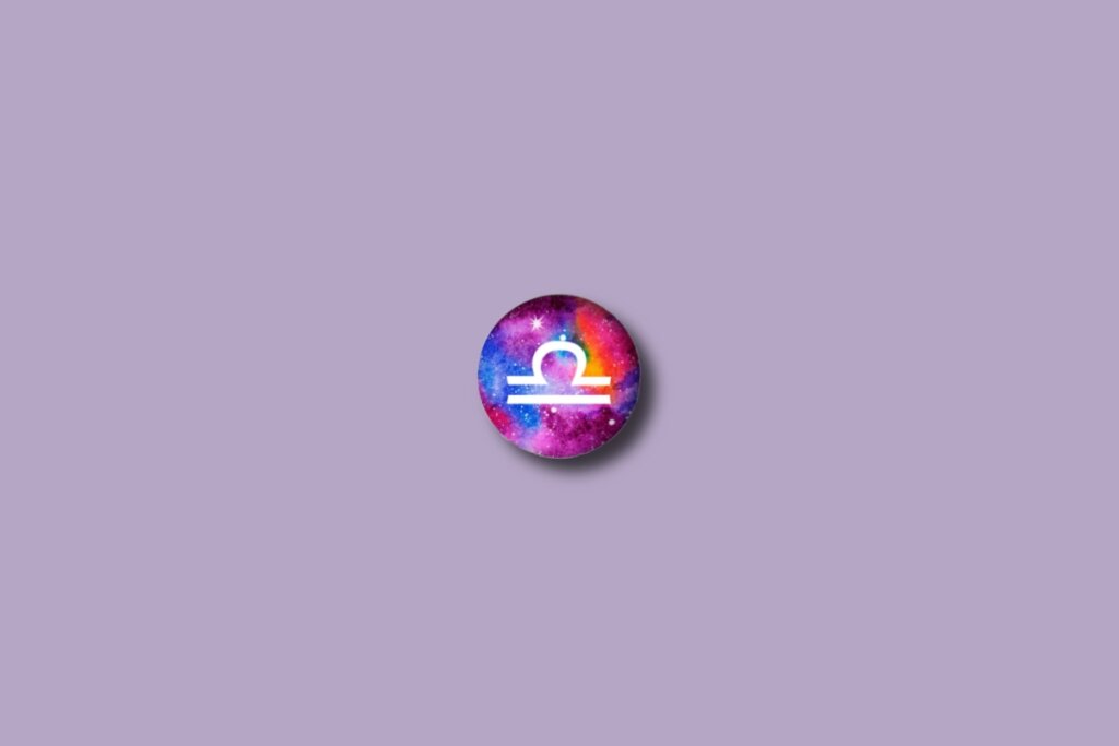 Ilustração do signo de libra em um círculo colorido e sobre um fundo lilás