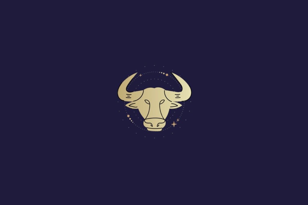 Ilustração dourada de cabeça de touro representando o signo de touro sobre fundo azul-escuro