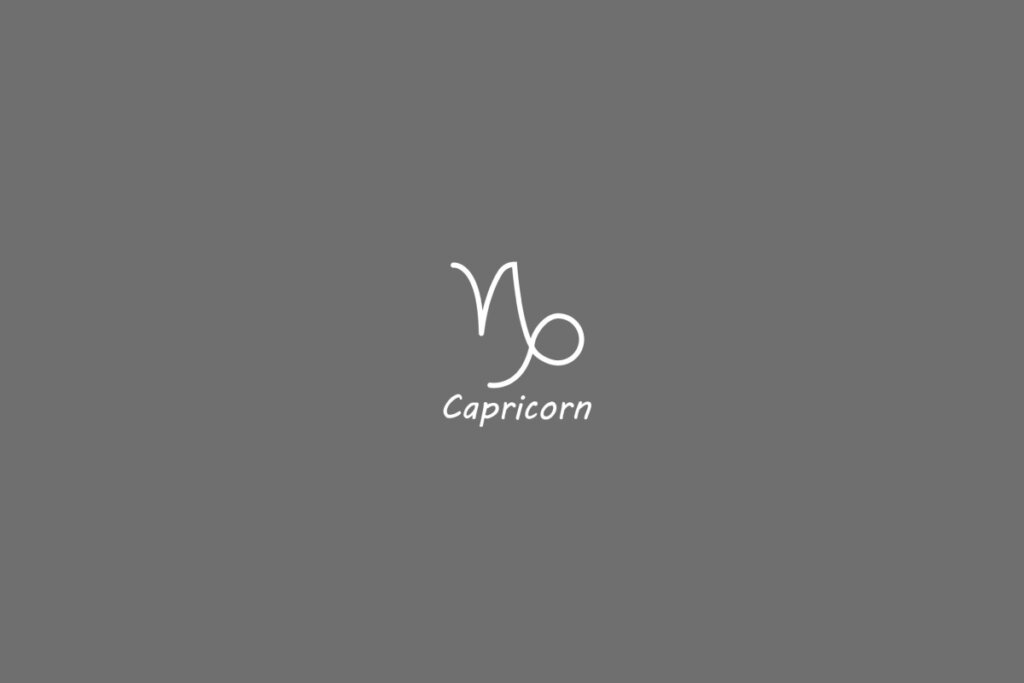 Símbolo do signo de capricórnio, na cor branca, centralizado em um fundo cinza e com o nome embaixo