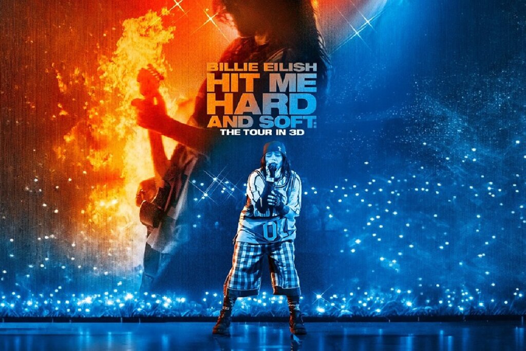 Pôster oficial do filme-concerto "HIT ME HARD AND SOFT: THE TOUR IN 3D" de Billie Eilish. A imagem mostra a artista cantando no palco, em meio a efeitos de luz azul, com sua própria silhueta e um guitarrista em chamas projetados no telão de fundo.