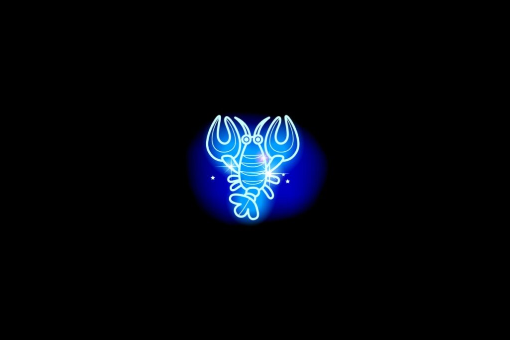 Ilustração do signo de câncer em azul sobre um fundo preto