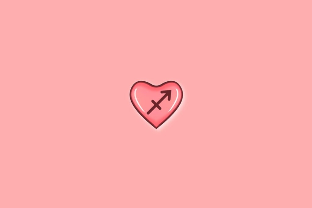 Coração em fundo vermelho-claro com o símbolo do signo de sagitário dentro