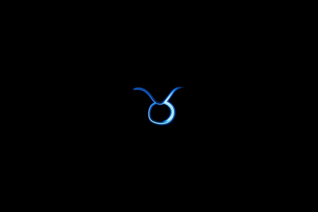 Ilustração do signo de touro em azul sobre um fundo preto