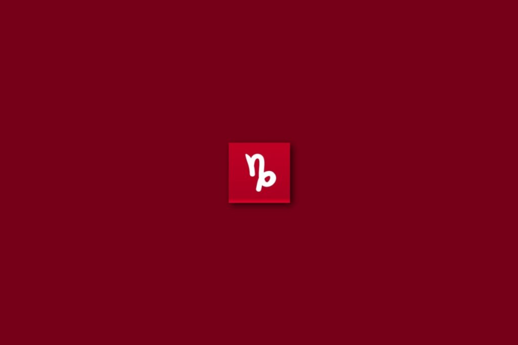 Ilustração do signo de capricórnio em um fundo vermelho