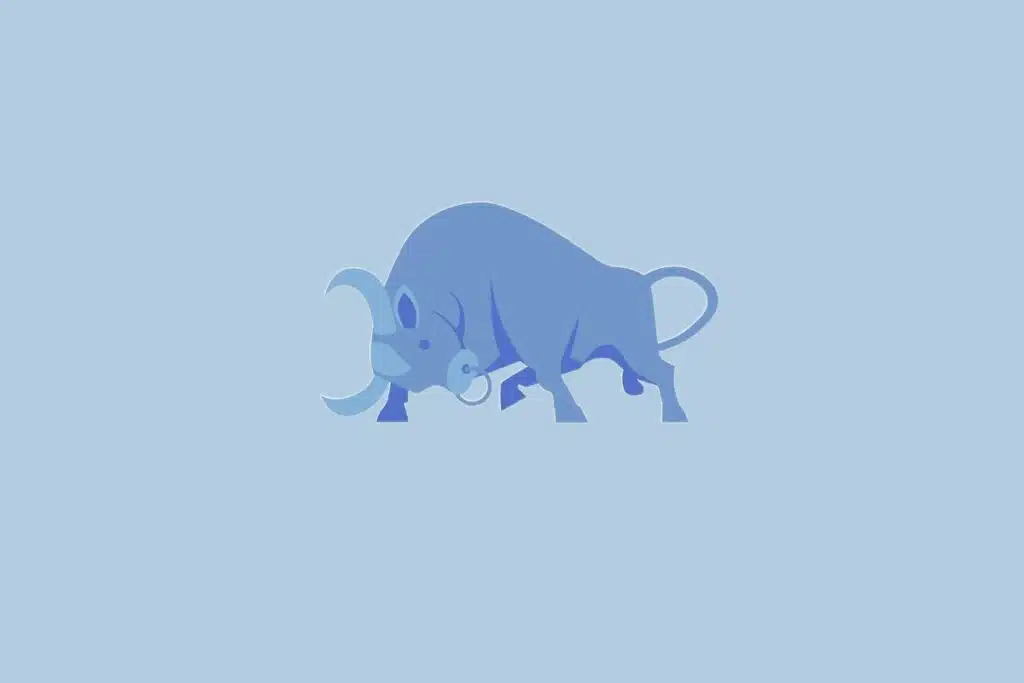 Ilustração do signo Touro, representado por um touro robusto com chifres curvados e corpo em tons de azul sobre fundo claro.