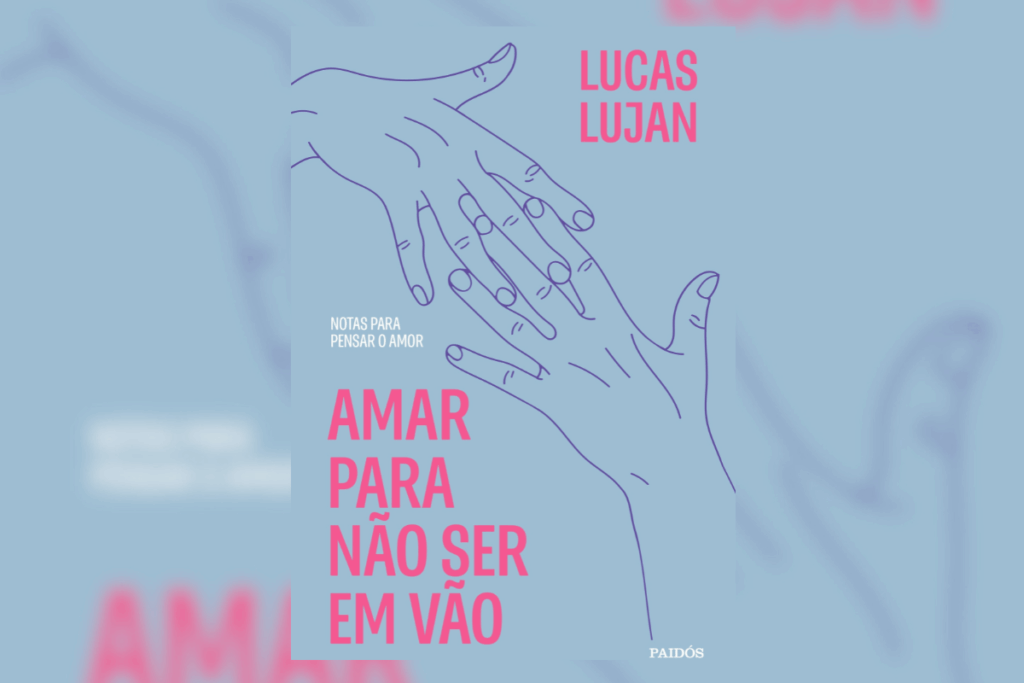 Capa do livro "Amar para não ser em vão: Notas para pensar o amor", de Lucas Lujan. Com fundo azul-claro, a capa traz a ilustração minimalista em linhas roxas de duas mãos se aproximando quase sem se tocar. O título e o nome do autor estão em destaque na cor rosa-chiclete.