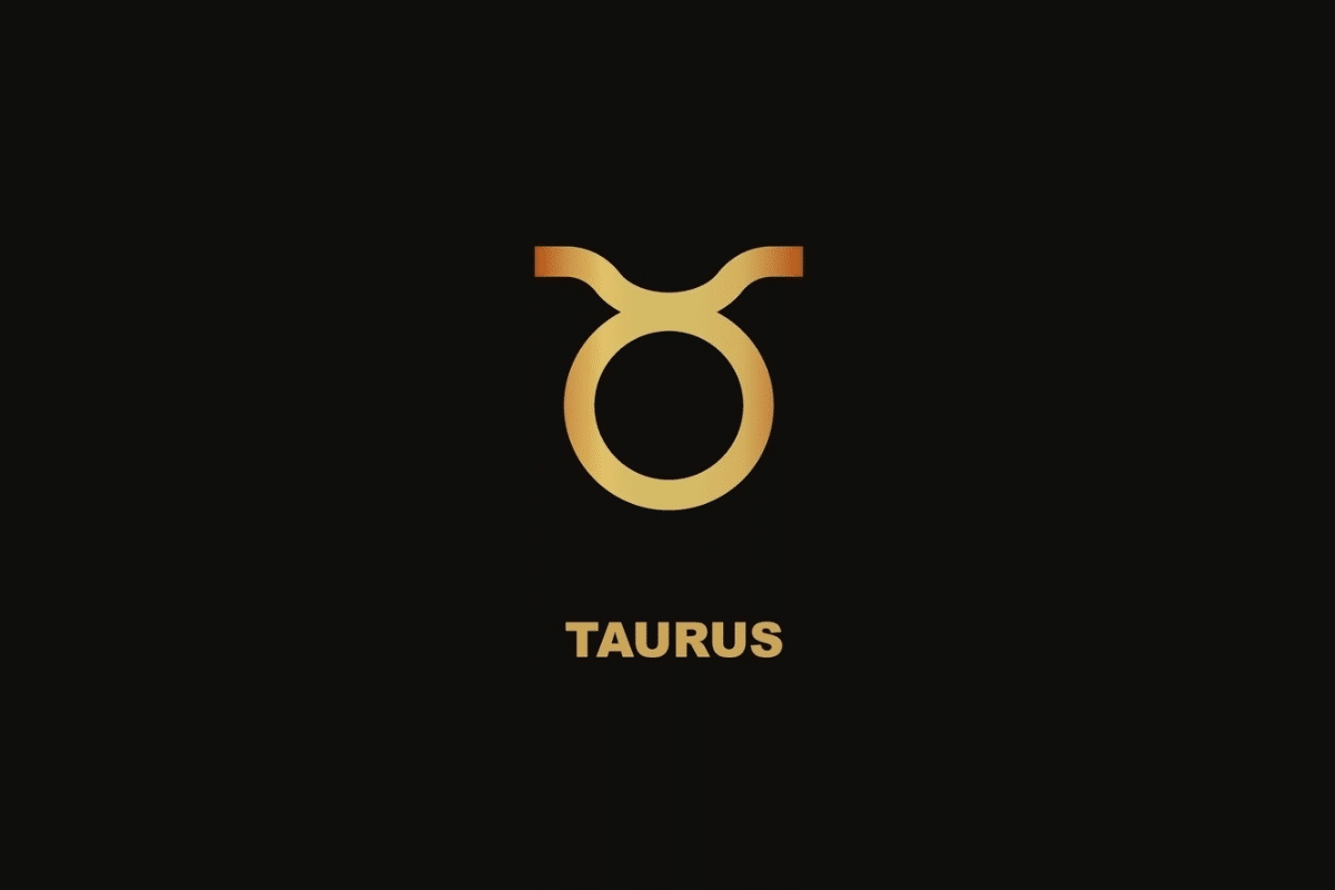 Símbolo dourado do signo de Touro sobre fundo preto, com o nome "TAURUS" escrito abaixo.