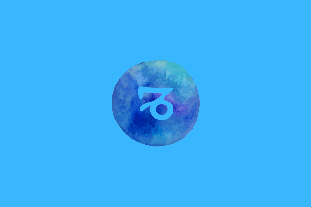 Símbolo do signo de Capricórnio em azul sobre um círculo azul com textura aquarelada, em um fundo azul-claro.