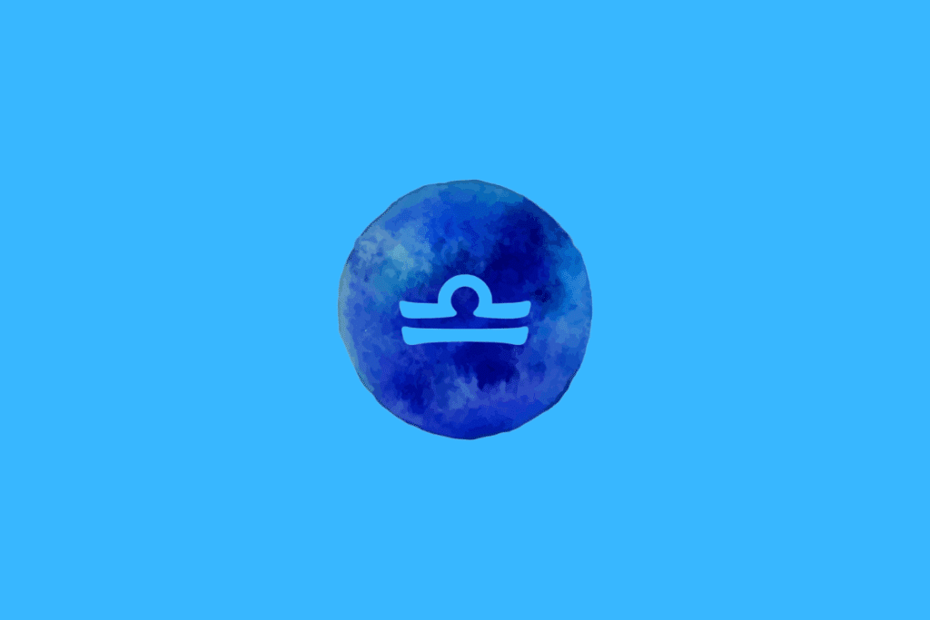 Símbolo do signo de Libra em azul sobre um círculo azul com textura aquarelada, em um fundo azul-claro.