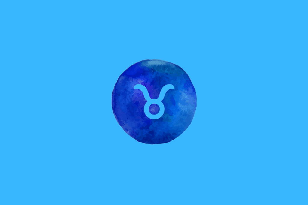 Símbolo do signo de Touro em azul sobre um círculo azul com textura aquarelada, em um fundo azul-claro.